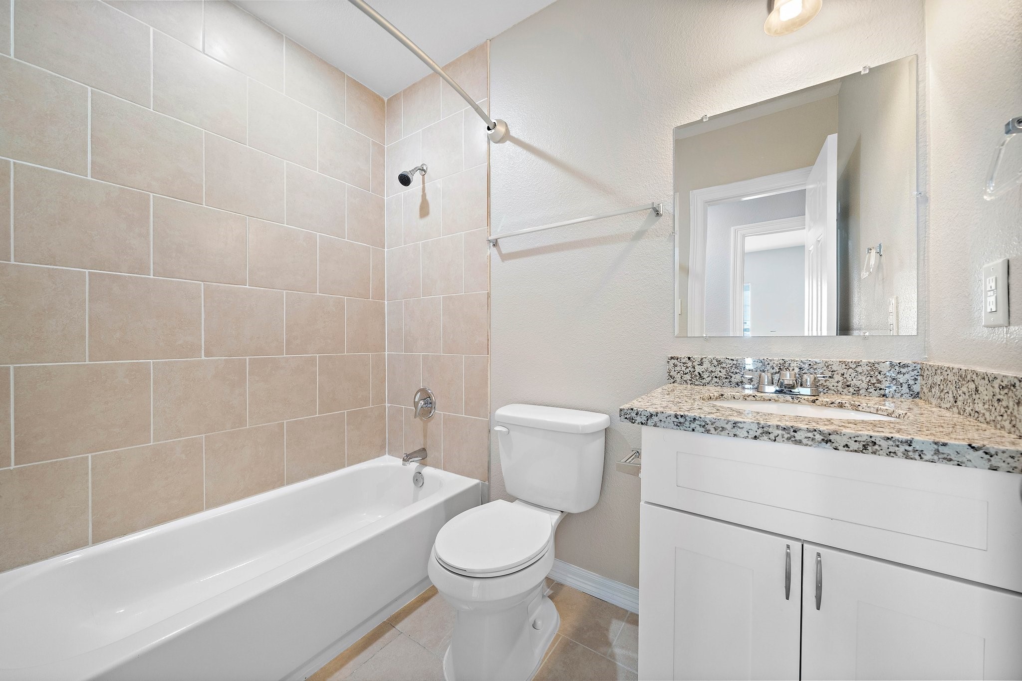 9118 Sandra Street, Unit B Houston, TX 77016 - Photo 5 of 10 a bathroom with a sink a toilet and a bathtub