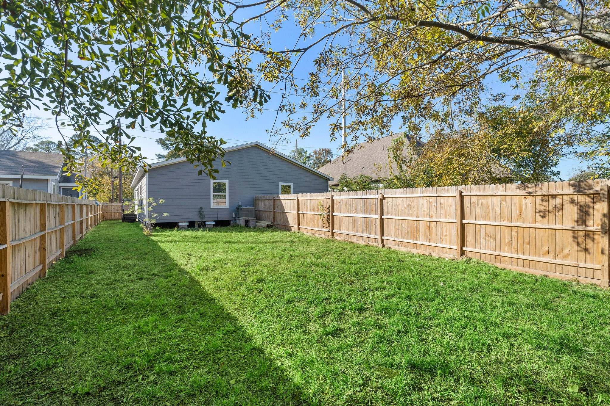 9118 Sandra Street, Unit B Houston, TX 77016 - Photo 9 of 10 a view of backyard with garden and deck