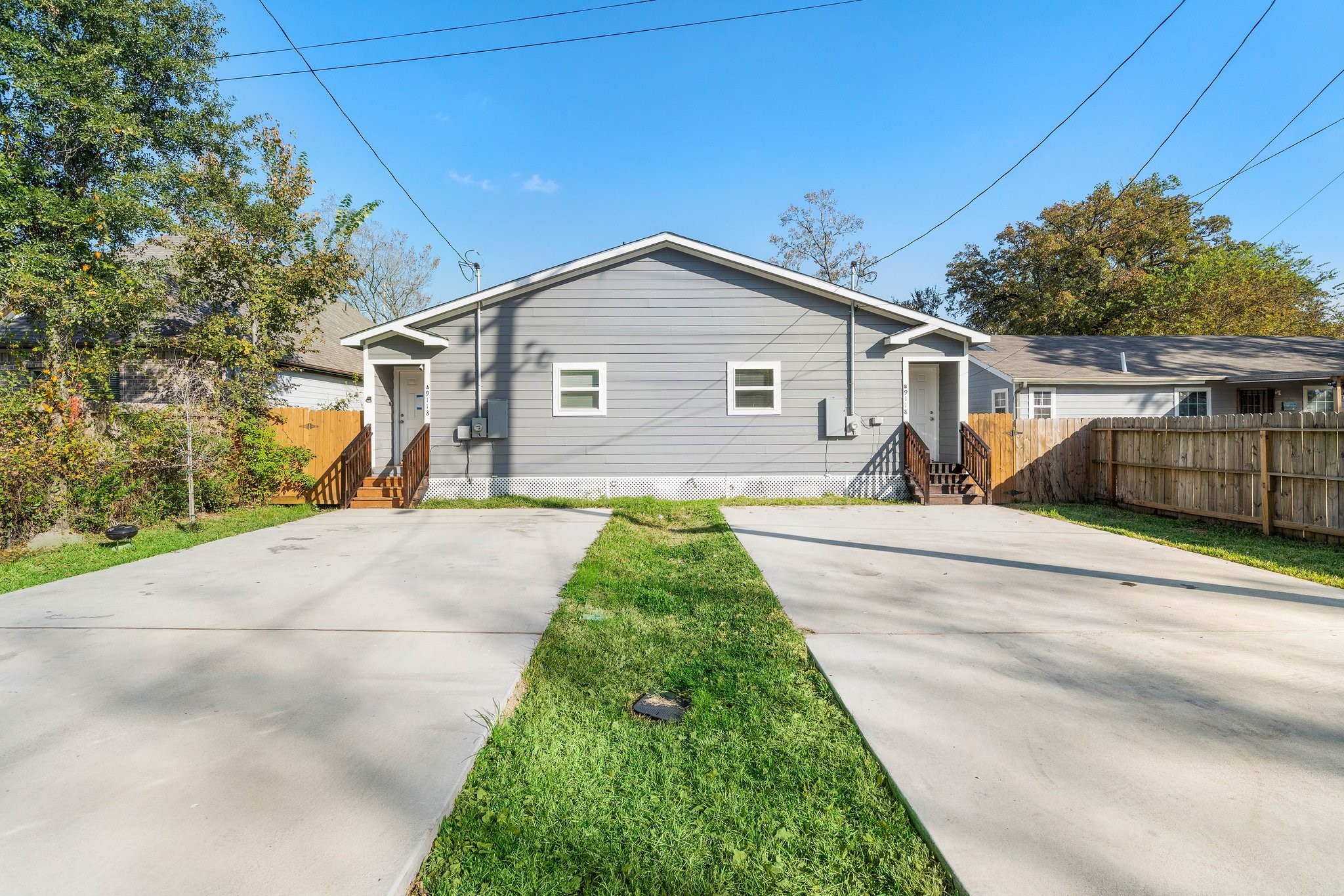9118 Sandra Street, Unit B Houston, TX 77016 - Photo 10 of 10 a front view of a house with a yard