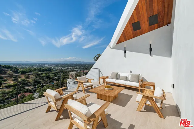 a view of a terrace with furniture