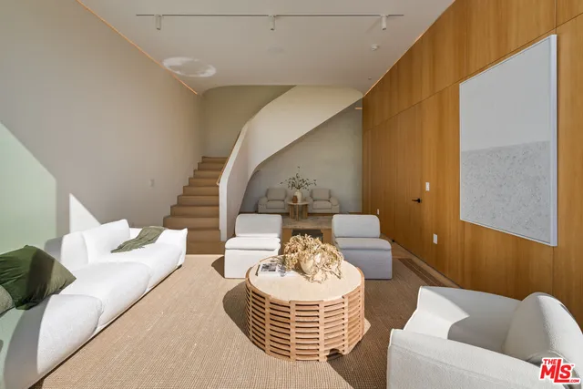 a view of a livingroom with furniture