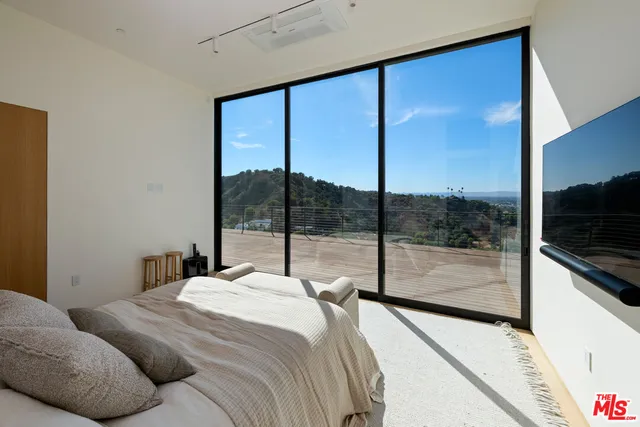 a spacious bathroom with a double vanity sink and a mirror