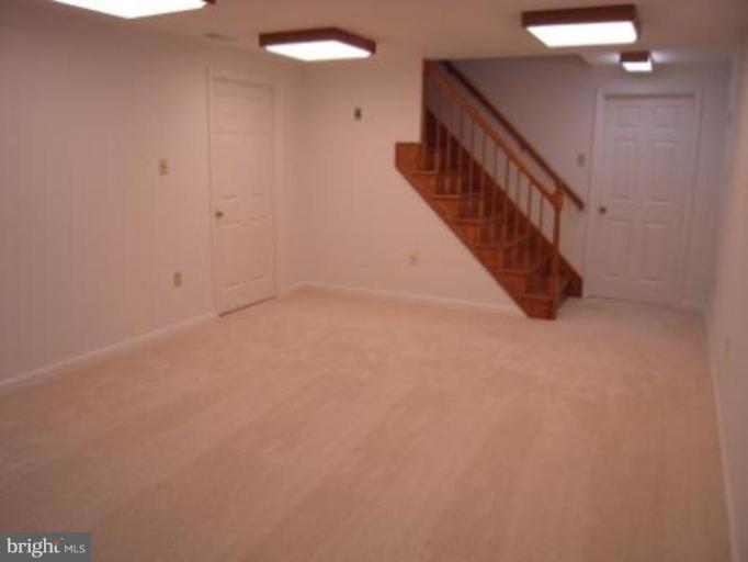 9155 Rockefeller Lane Springfield, VA 22153 - Photo 13 of 15 a view of a hallway with staircase
