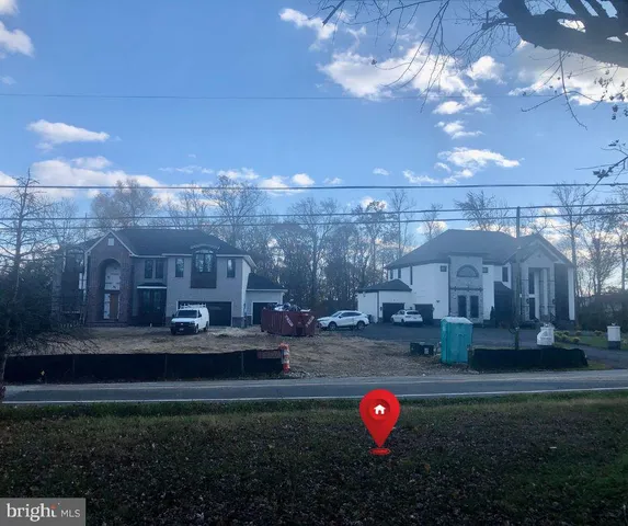 a aerial view of a house with yard