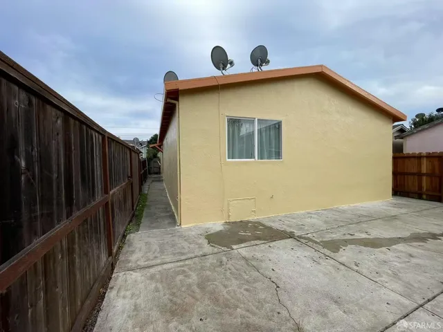 a view of a house with wooden wall