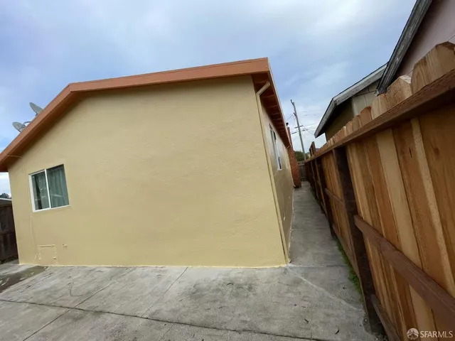 a view of backyard with small cabin