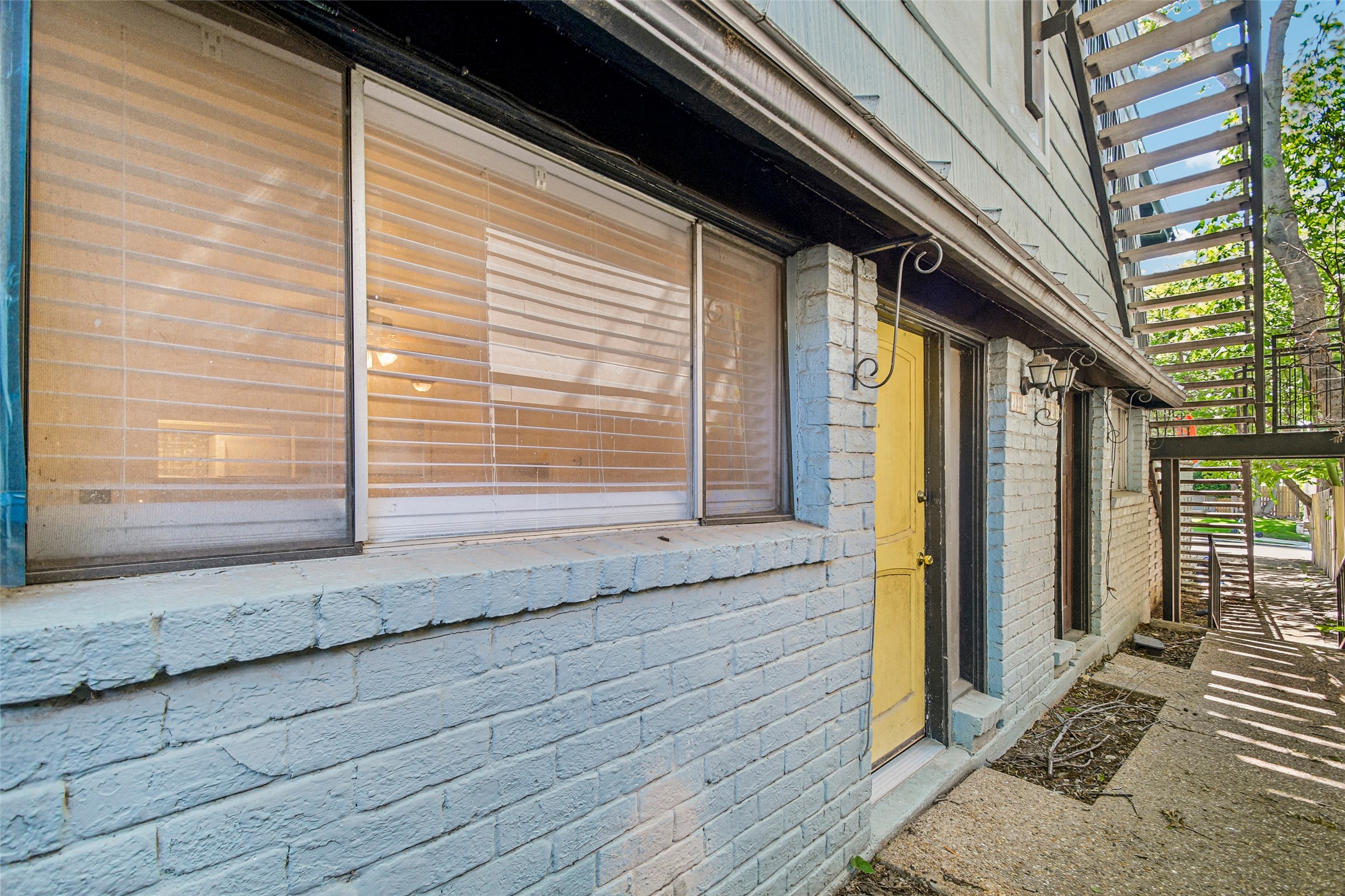 2413 Leon Street, Unit 104 Austin, TX 78705 - Photo 2 of 26 a view of a house with a wooden door