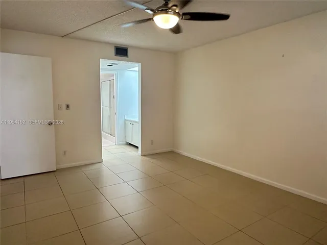 an empty room with a bathroom