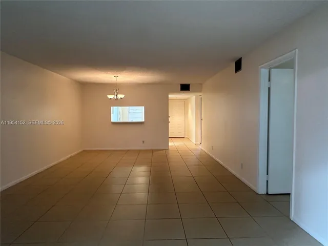 a view of an empty room and window