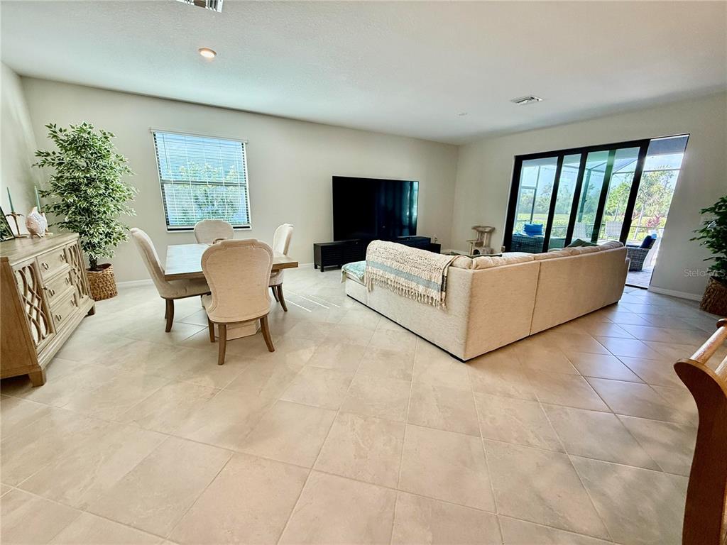 10852 Sun Drop Street Venice, FL 34293 - Photo 7 of 15 a living room with furniture and a window