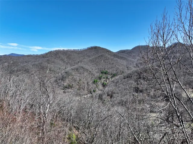a view of a mountain range in a cloudy sky