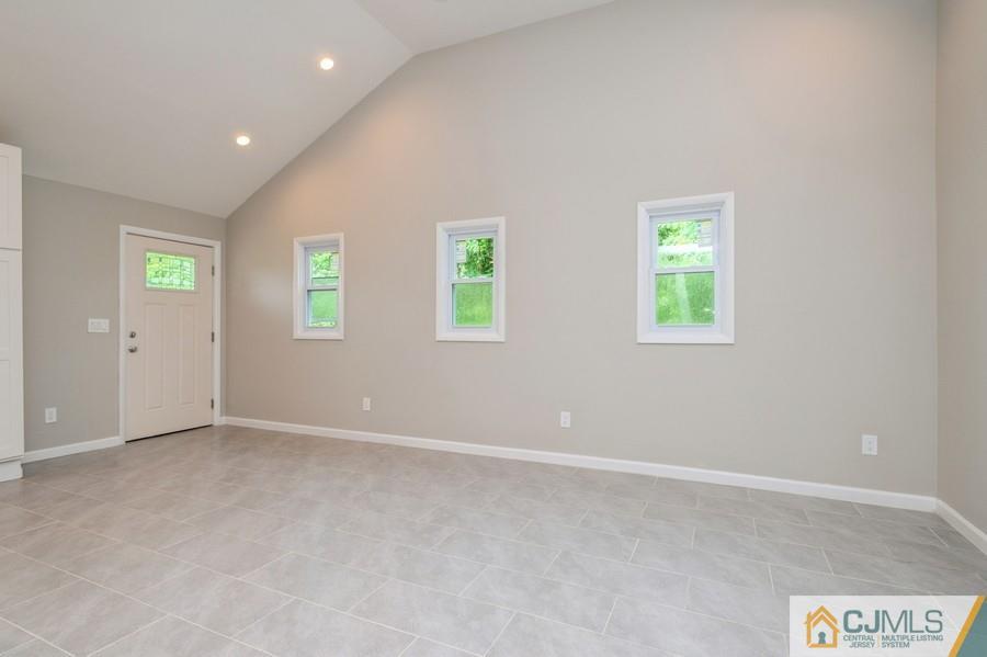 139 Tennent Road Morganville, NJ 07751 - Photo 6 of 15 an empty room with windows and closet