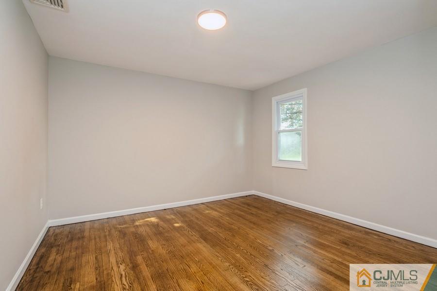 139 Tennent Road Morganville, NJ 07751 - Photo 9 of 15 wooden floor in a room