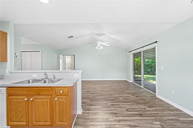 a bathroom with a sink vanity granite and a mirror