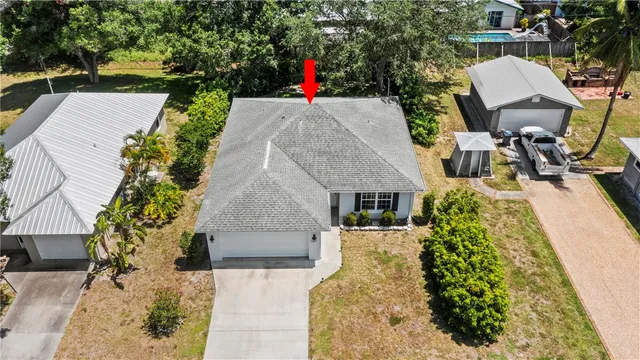 a view of a backyard with sitting area