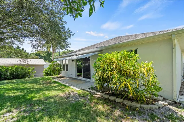 a view of a garden with a building in the back