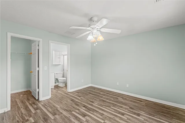 a view of a room with a ceiling fan