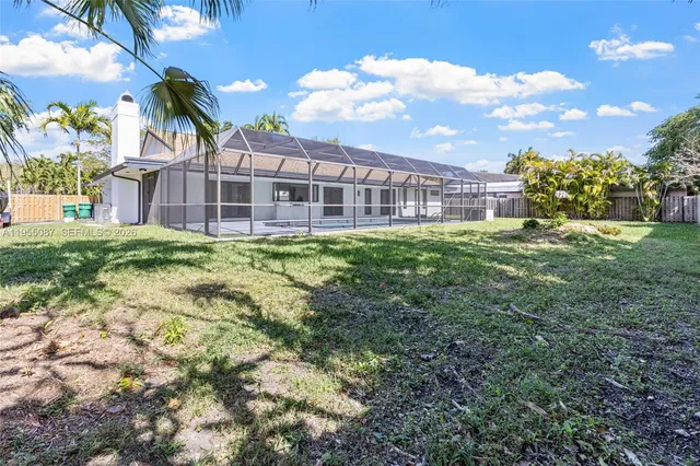 an aerial view of a residential apartment building with a yard