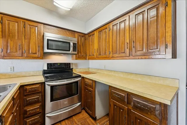 a kitchen that has a sink and a stove