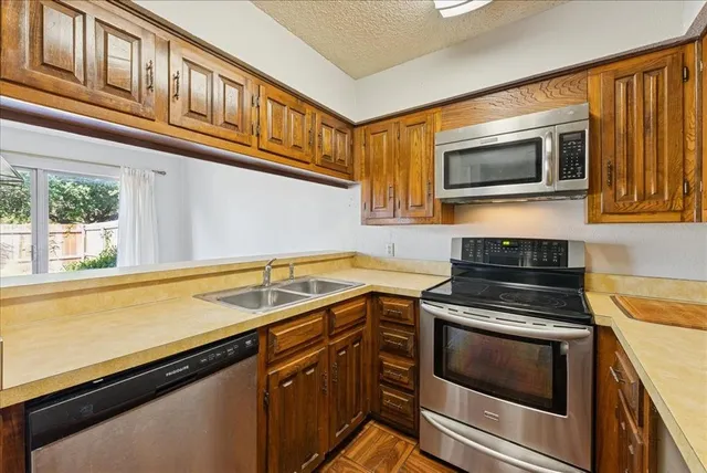 a kitchen with a refrigerator and cabinets