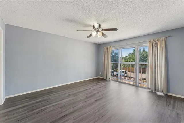 a bathroom with a granite countertop sink toilet and a mirror