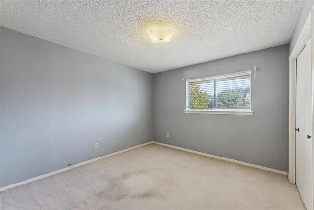 a view of a backyard with sitting area