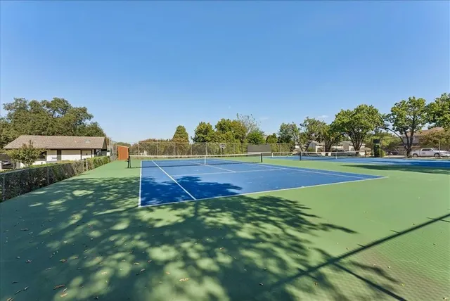 a view of an outdoor space and tennis court