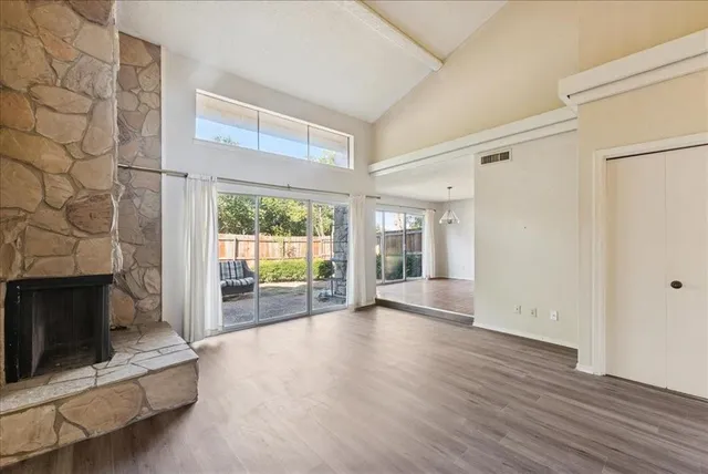 a view of an entryway with wooden floor