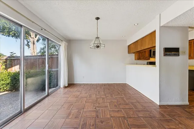 a view of empty room with windows