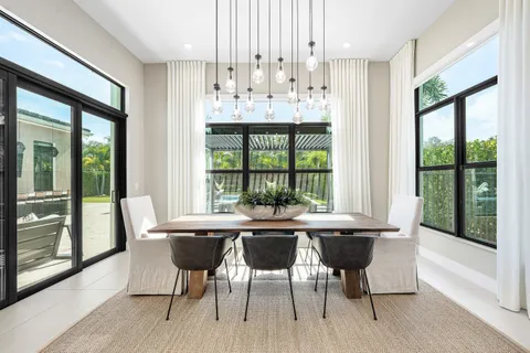 a kitchen with a table and chairs in it