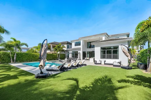 a view of a house with a yard porch and sitting area