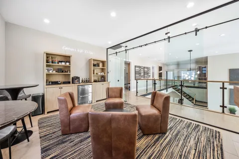 a bedroom with a large bed couch and a window