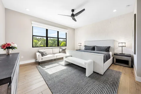 a bed room with a bed and a window