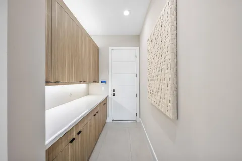 a view of swimming pool with lounge chair and dinning table under an umbrella