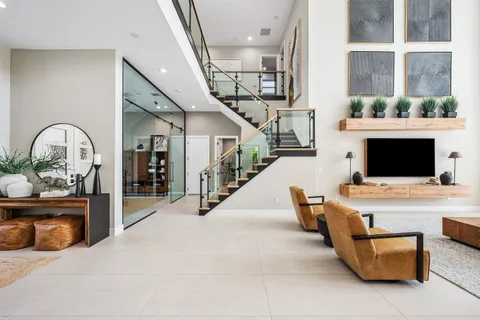 a kitchen with kitchen island granite countertop a sink counter top space appliances and cabinets