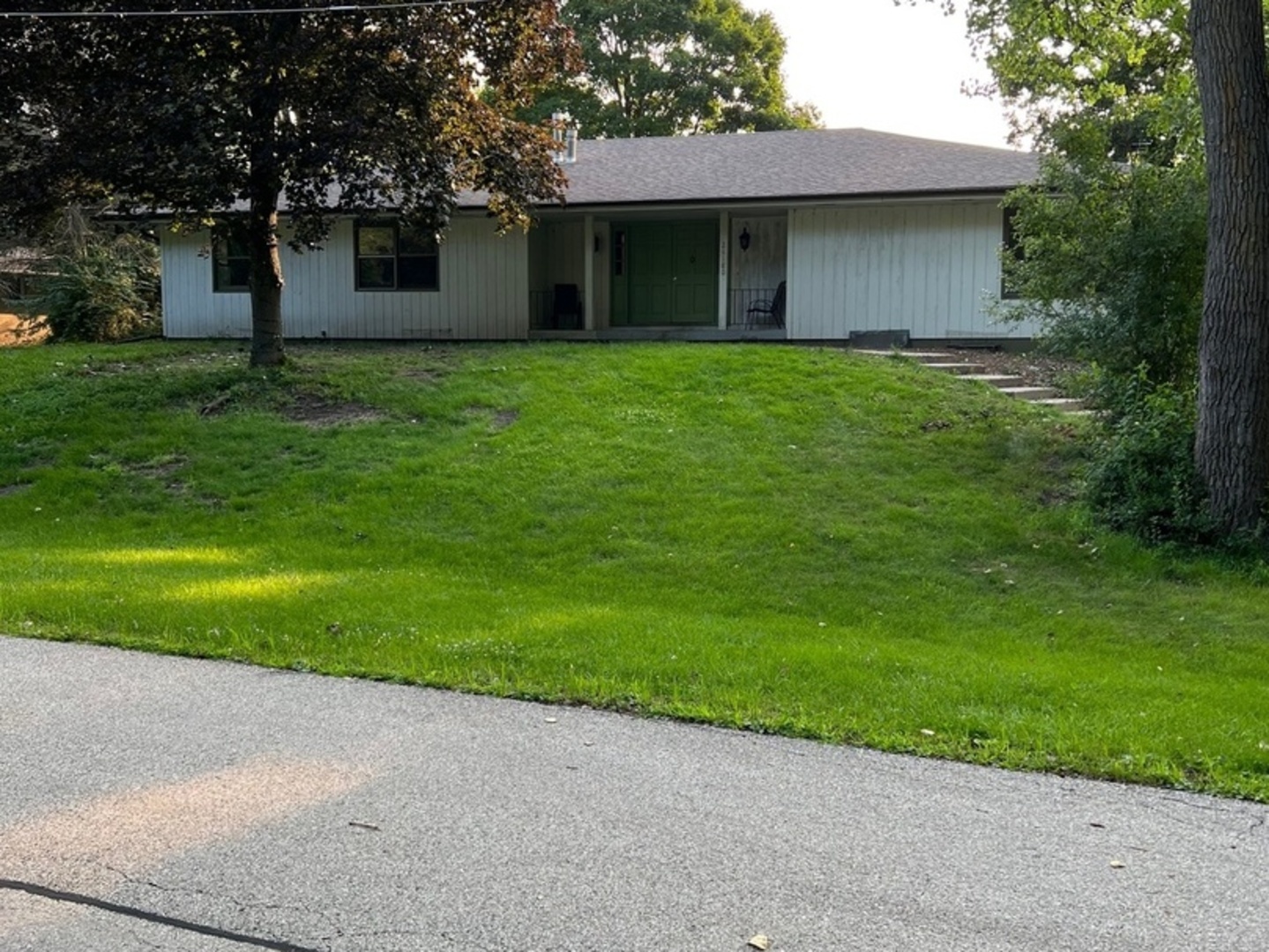 26180 North Willow Road Barrington, IL 60010 - Photo 1 of 11 a front view of a house with garden