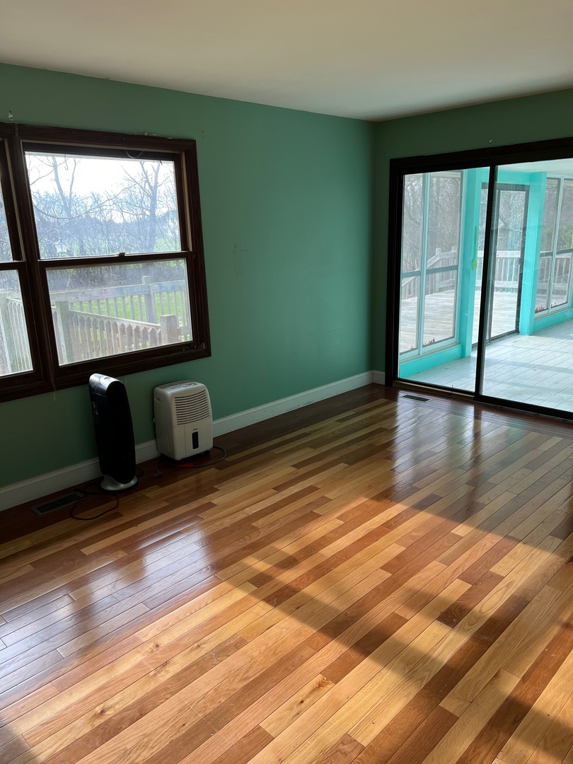 26180 North Willow Road Barrington, IL 60010 - Photo 11 of 11 a view of an empty room with wooden floor and a window