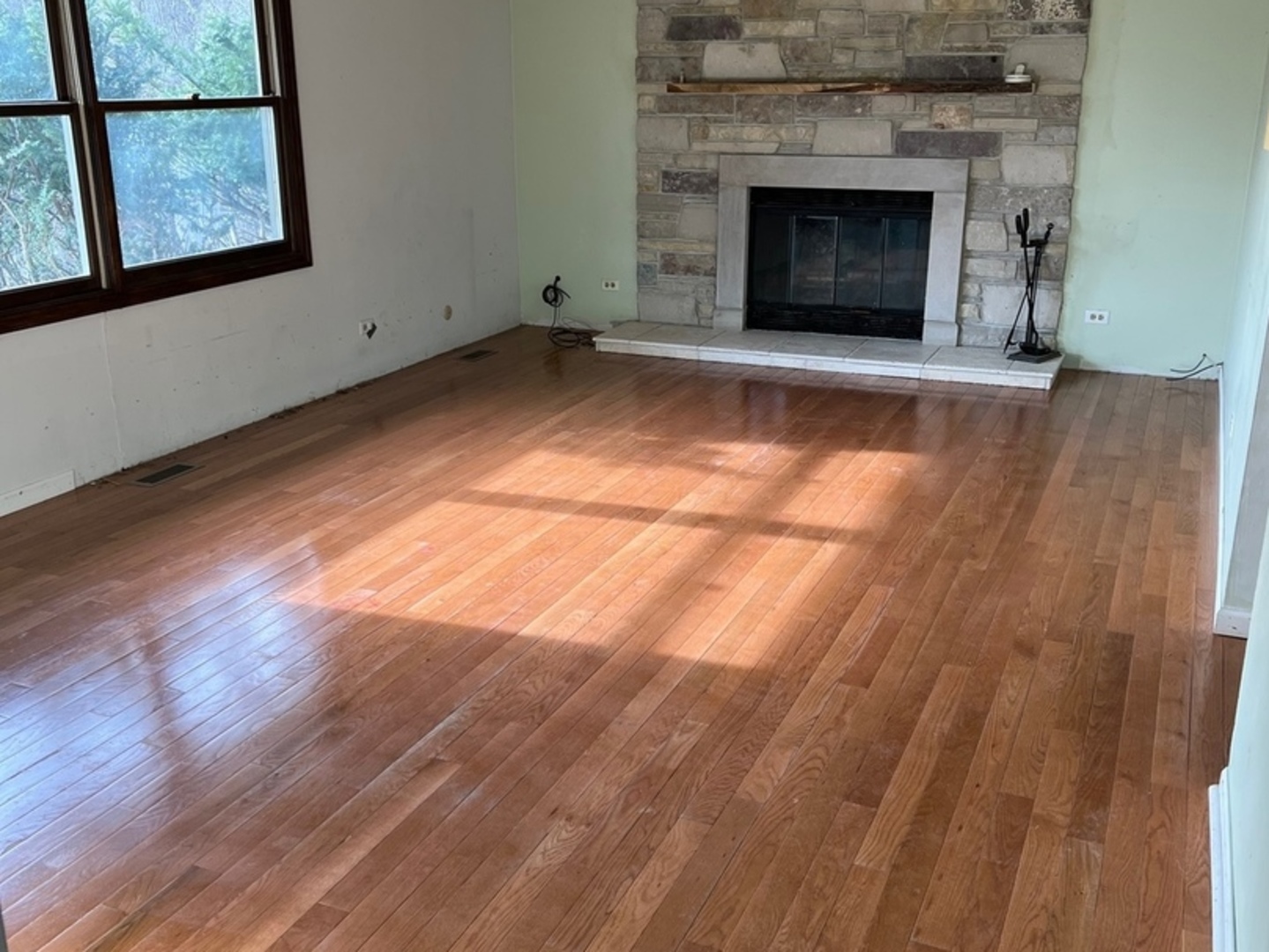26180 North Willow Road Barrington, IL 60010 - Photo 5 of 11 a view of empty room with wooden floor and fireplace