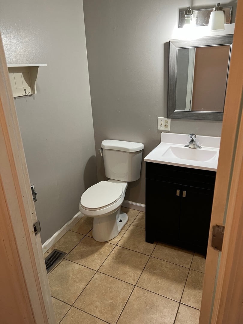 26180 North Willow Road Barrington, IL 60010 - Photo 8 of 11 a bathroom with a sink toilet and mirror