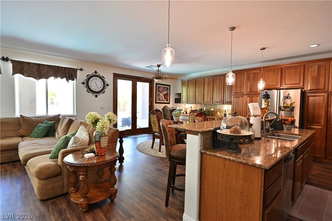 2729 Kildrummie Street Henderson, NV 89044 - Photo 41 of 42 An open floorplan seamlessly connects the well-appointed kitchen to a comfortable living area.