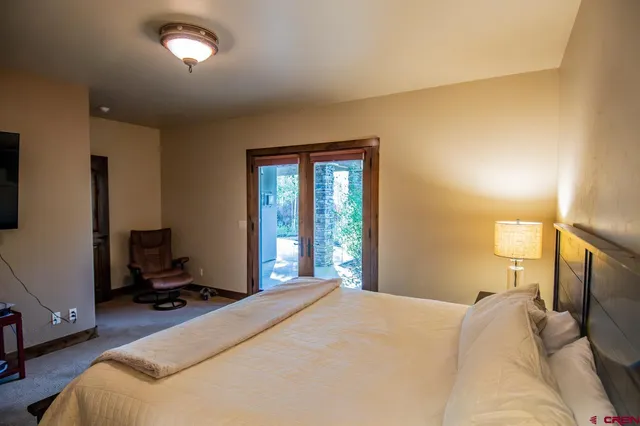 a bed room with a bed and a window