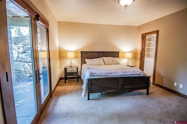 a bathroom with a granite countertop toilet a sink and a bathtub