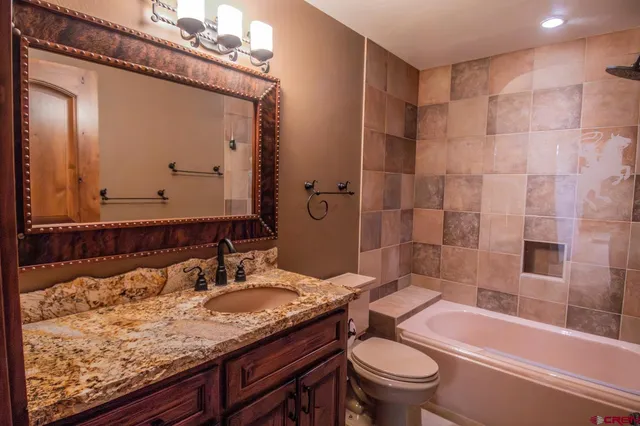 a living room with furniture gym equipment and a large window