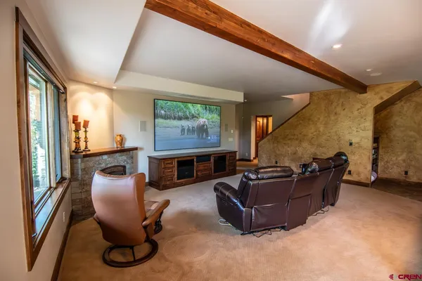 a kitchen with a stove a refrigerator and dining table