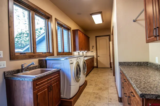 a view of a granite countertop kitchen with a sink and dishwasher
