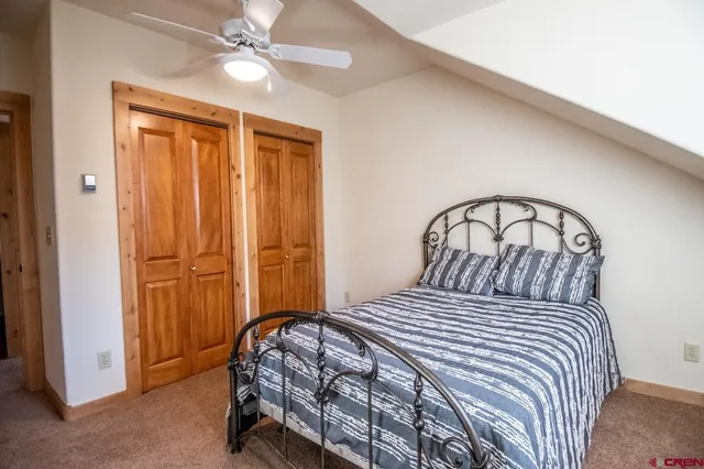 a bathroom with a double vanity sink a mirror and a bathtub