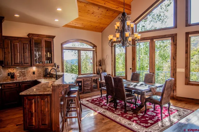 a view of a dining room with furniture window and outside view