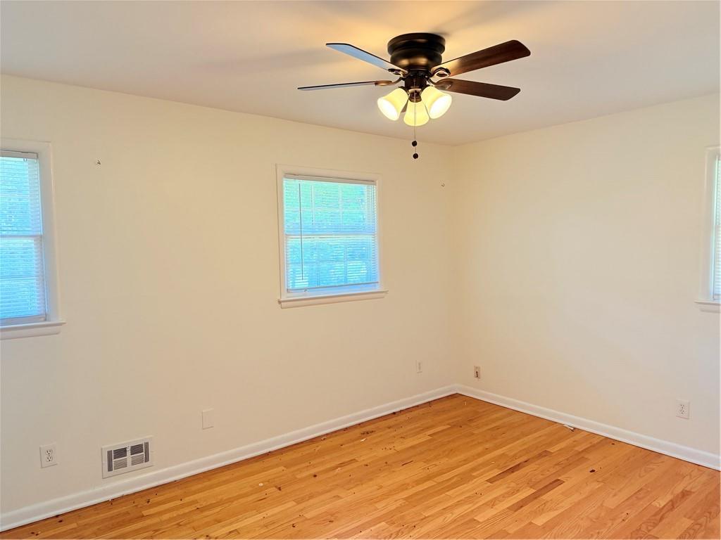 3460 Boring Road Decatur, GA 30034 - Photo 12 of 16 an empty room with a window and a ceiling fan