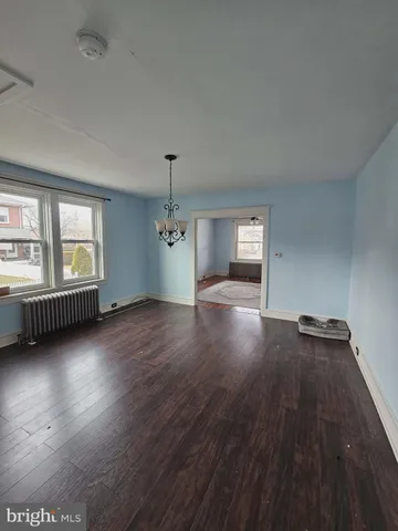 a view of room with furniture and a bookshelf