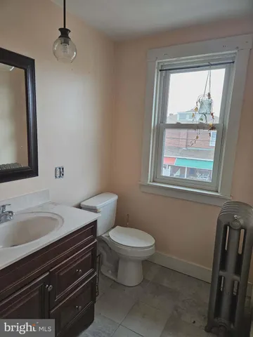 a view of a gym with wooden floor